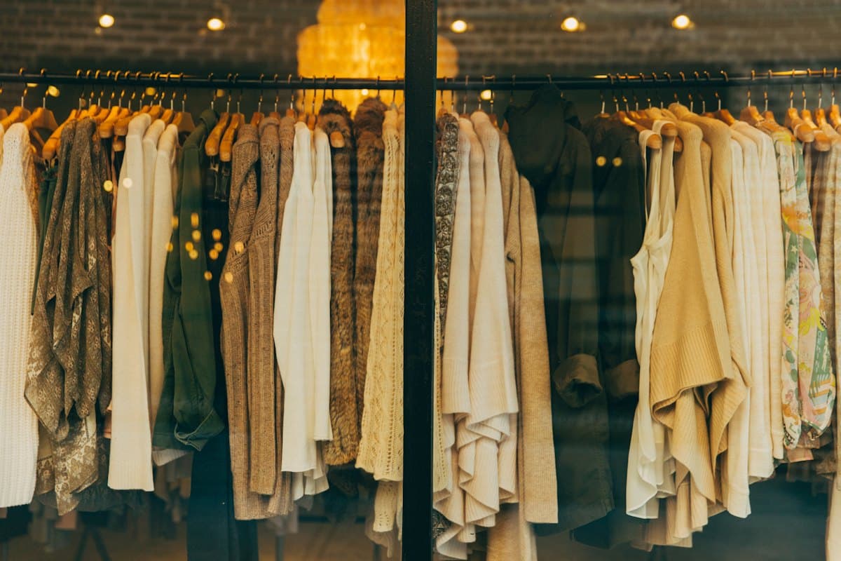 A rail of neutral-toned clothes